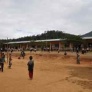 primary school students playing outside their new school